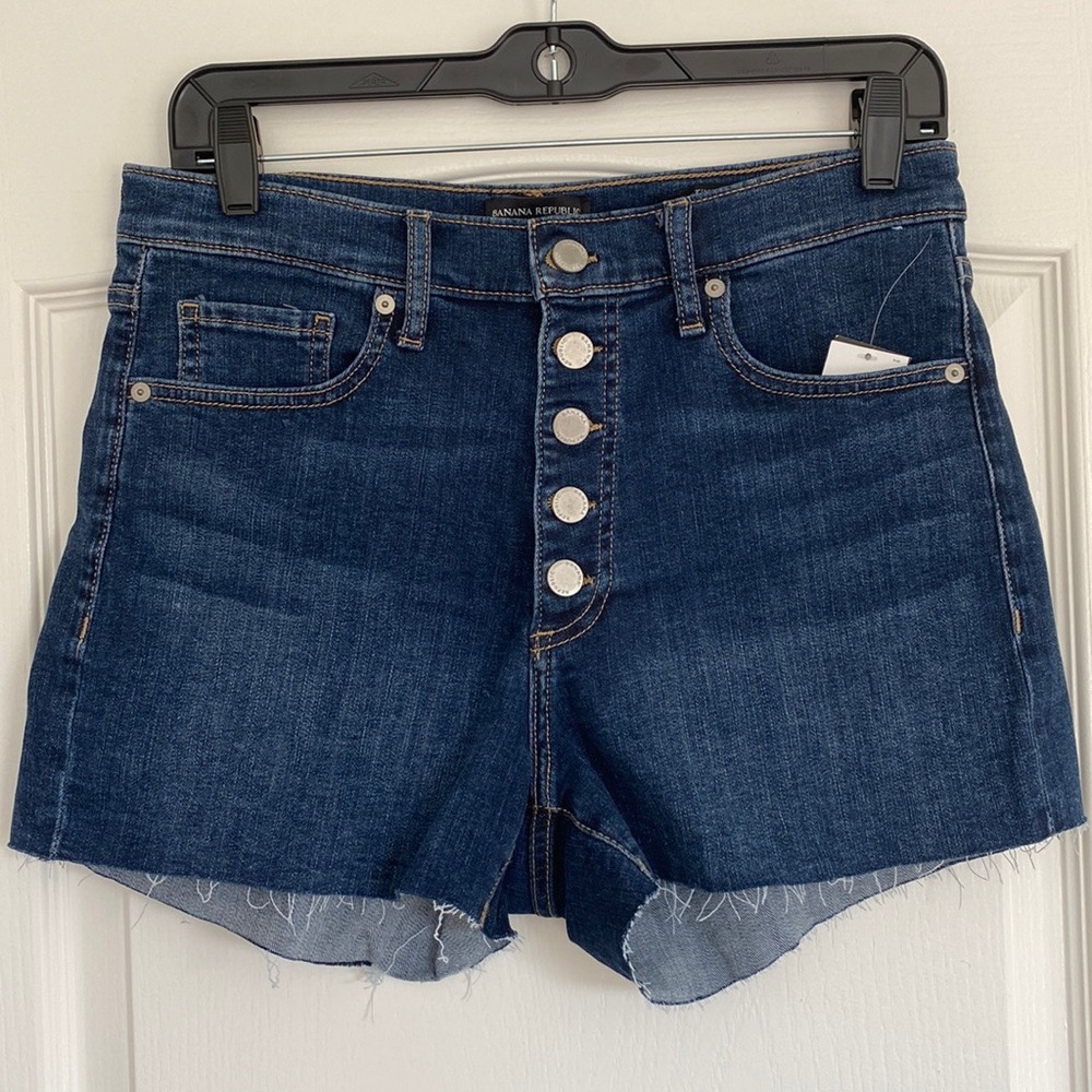 Dark blue wash button front jean shorts
